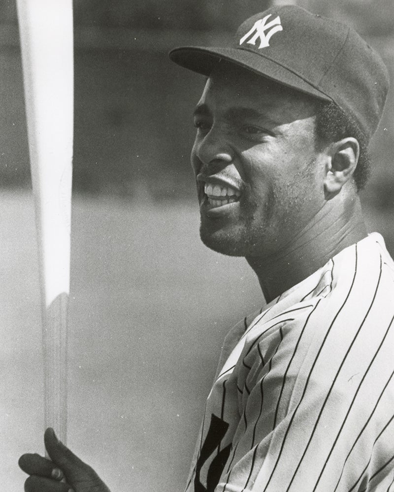 Alex Johnson in Yankees uniform holding bat